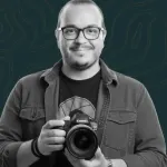 Portrait of Diego Calvo holding a camera