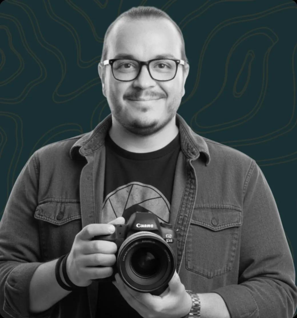 Portrait of Diego Calvo holding a camera
