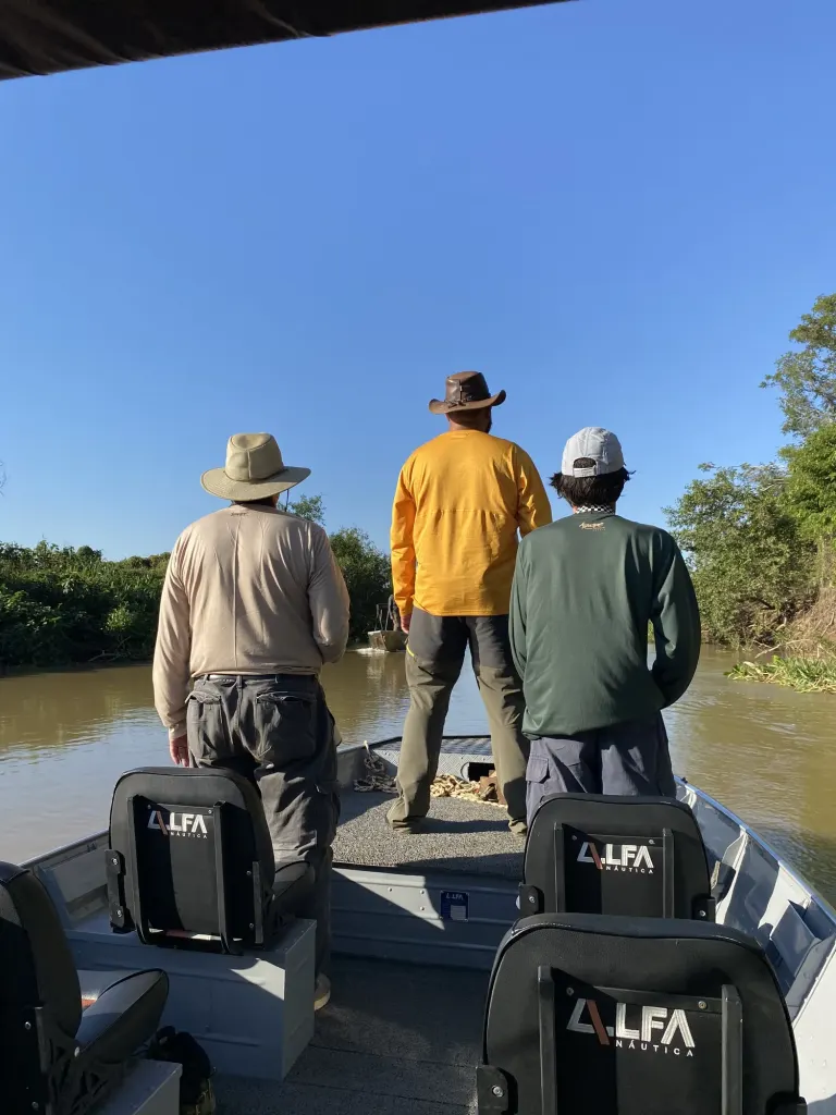 Guests standing on a river safari boat
