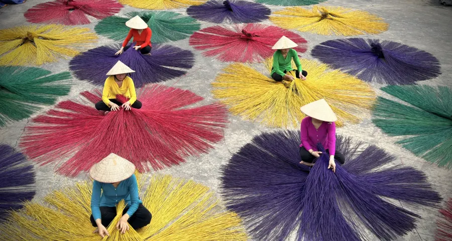 Multicoloured incense fans drying in a courtyard