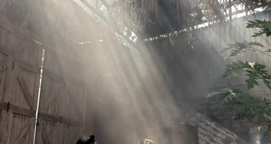 Sunbeams falling across a traditional weaving workshop